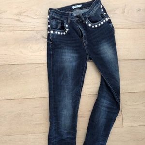 Super stretchy jeans with 'pearl' studs.